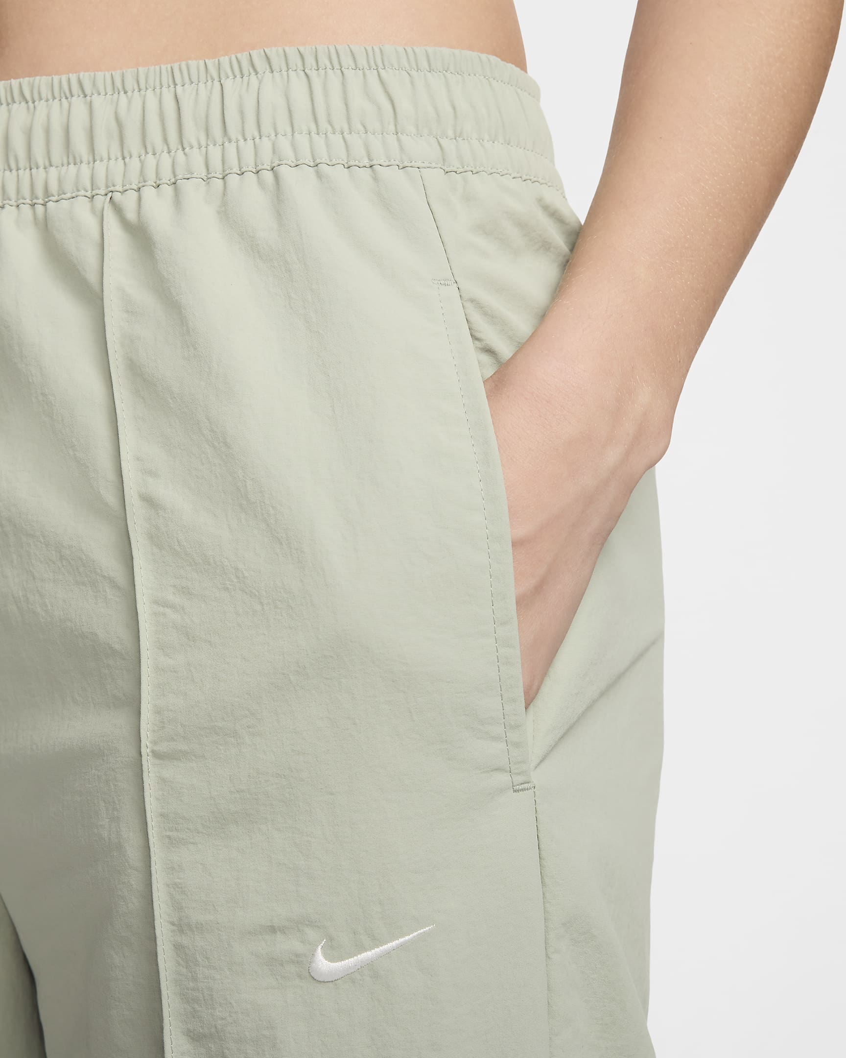 Pants de tiro medio con dobladillo abierto para mujer Nike Sportswear Everything Wovens - Horizonte jade/Vela