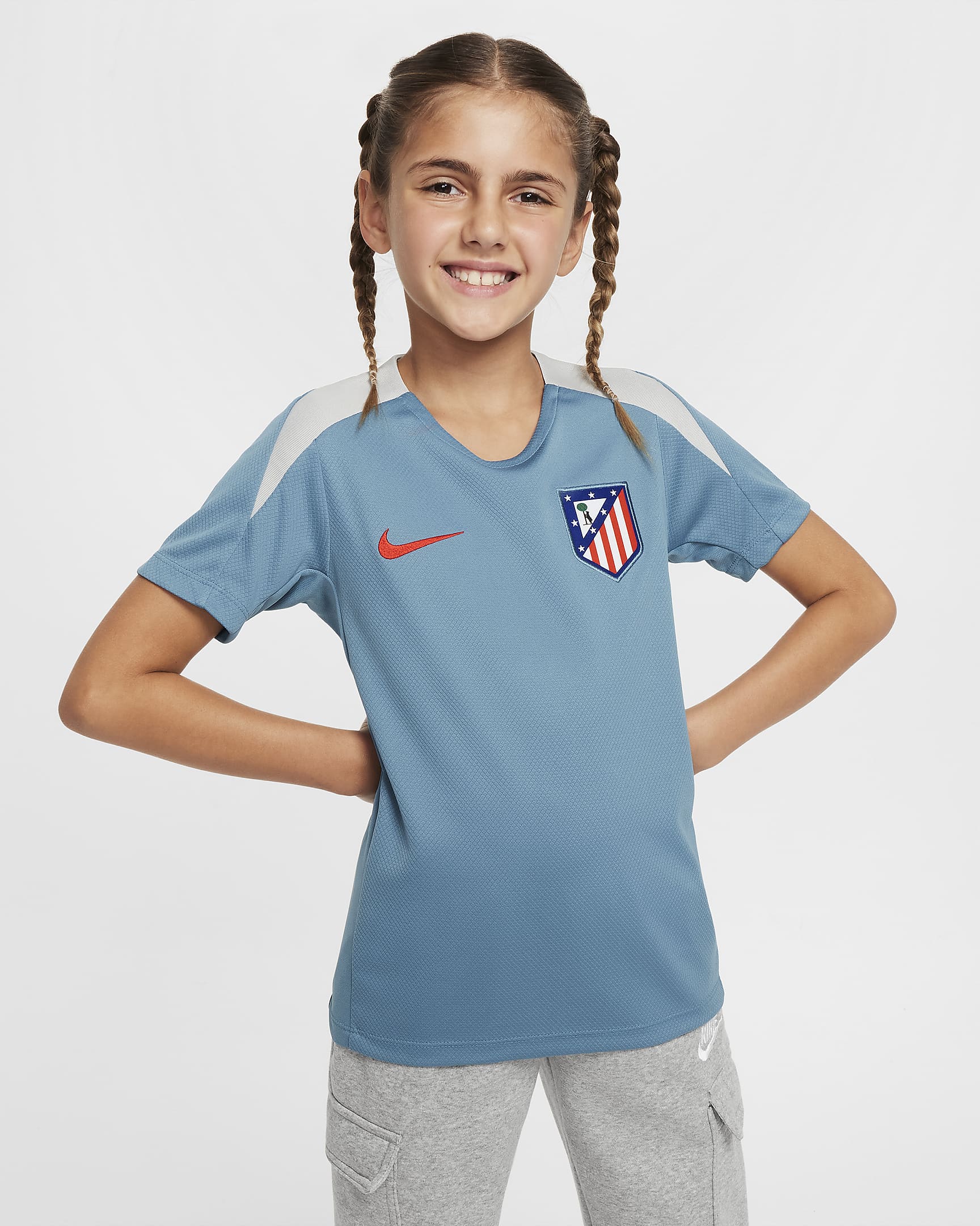 Atlético Madrid Strike Older Kids' Nike Dri-FIT Football Short-Sleeve Knit Top - Noise Aqua/Light Iron Ore/Light Crimson