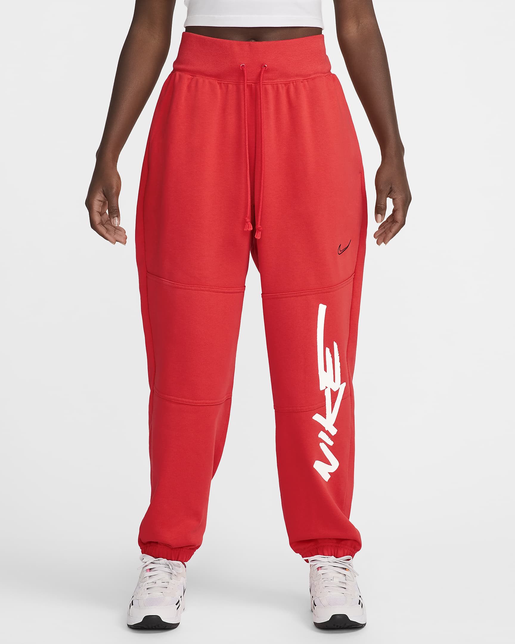 Calças folgadas em tecido moletão e com cintura normal Nike Sportswear Breaking para mulher - Carmesim claro