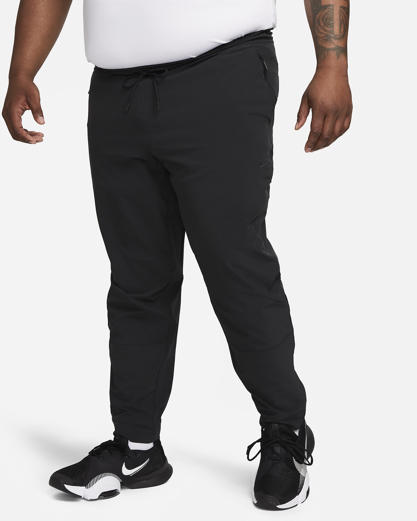 Nike Unlimited Men's Dri-FIT Zip Cuff Versatile Trousers. Nike BE