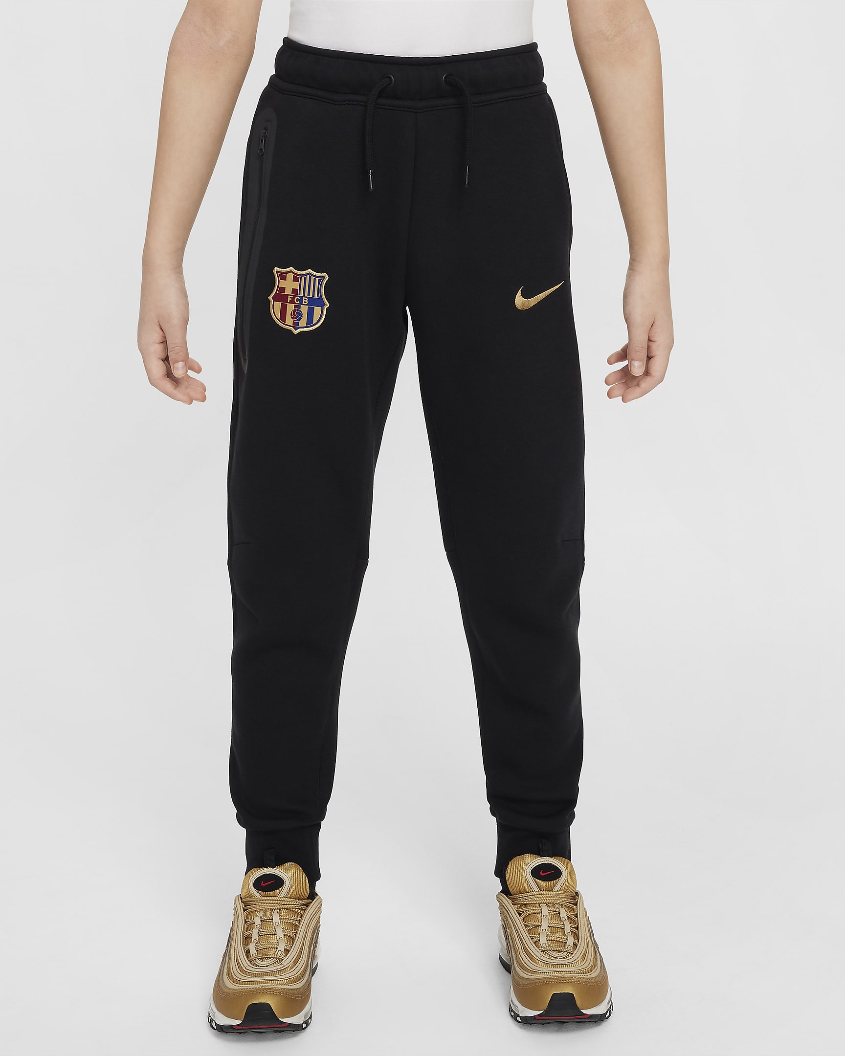 Spodnie piłkarskie dla dużych dzieci (chłopców) Nike FC Barcelona Tech Fleece - Czerń/Club Gold