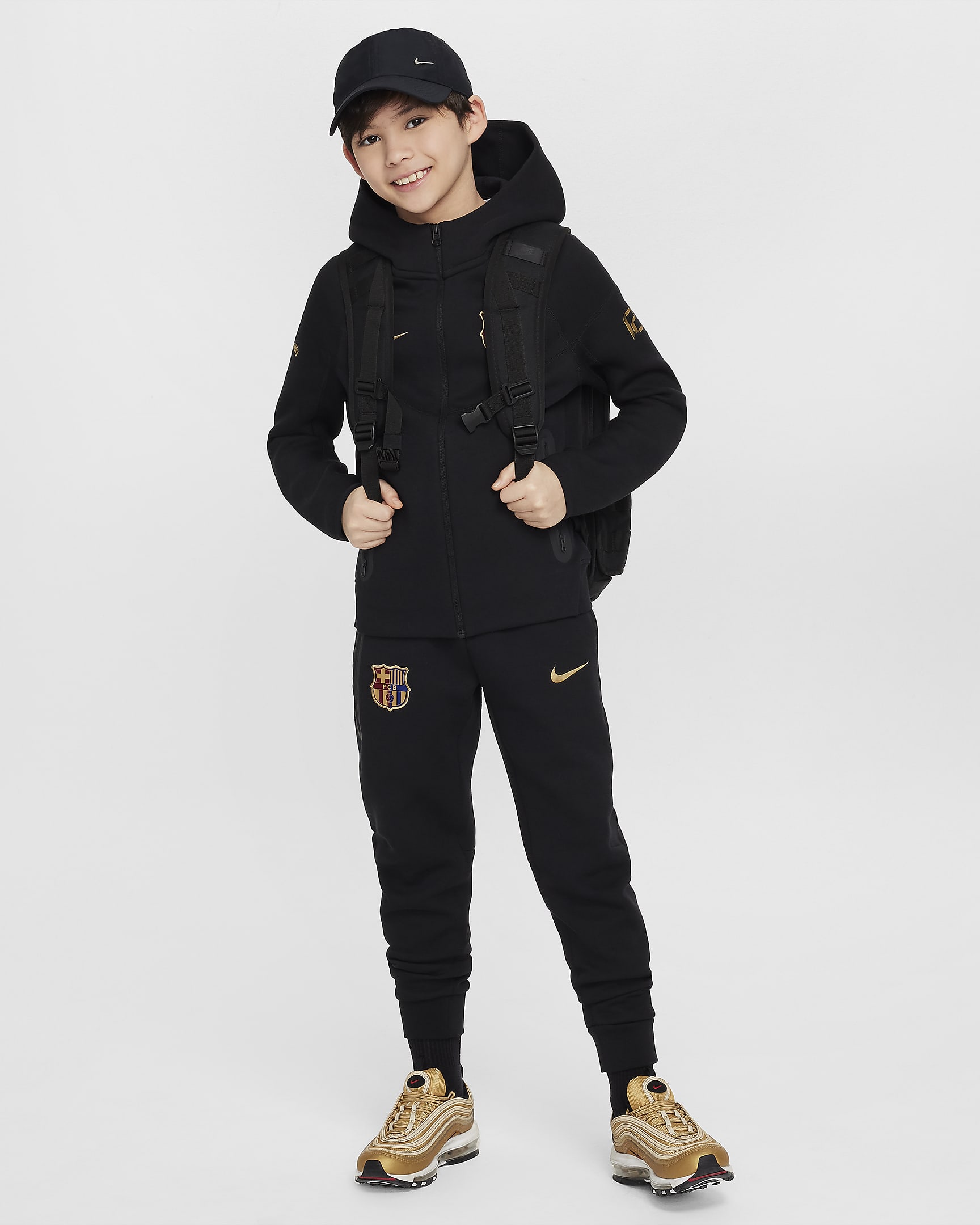 FC Barcelona Tech Fleece Nike fotballbukse til store barn (gutt) - Svart/Club Gold