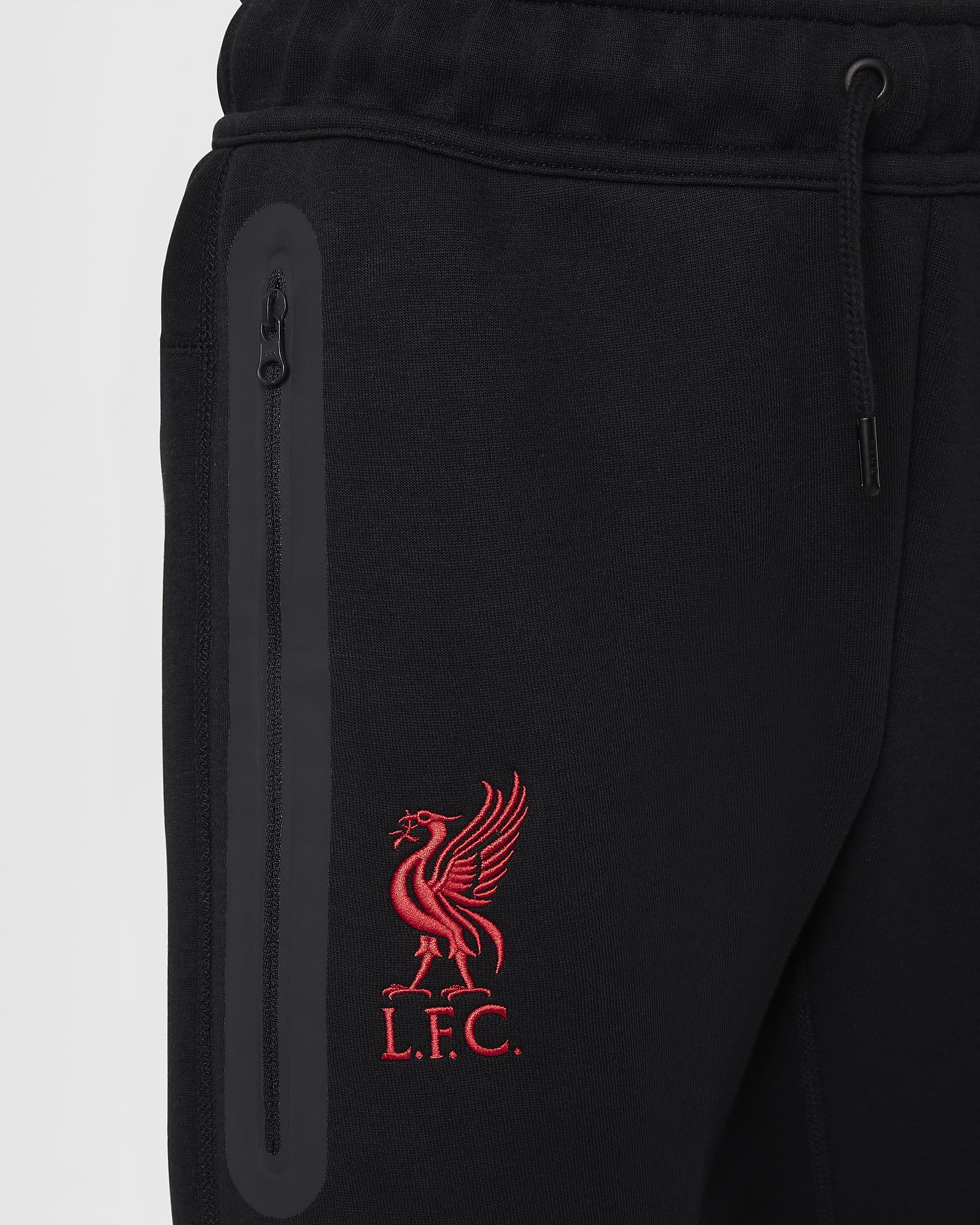 Liverpool FC Tech Fleece Nike Football bukse til store barn (gutt) - Svart/Svart/Gym Red