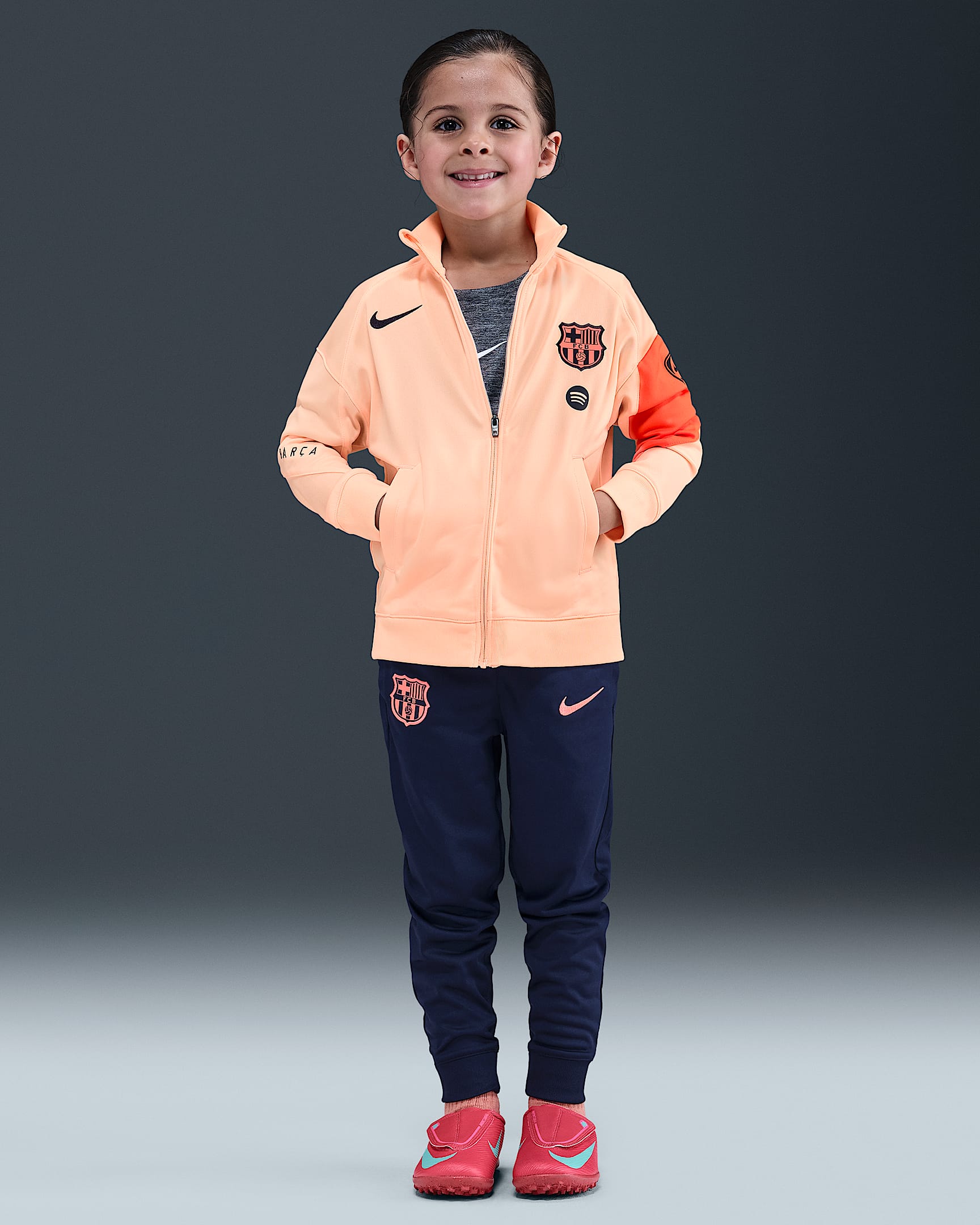 F.C. Barcelona Strike Third Younger Kids' Nike Dri-FIT Total 90 Football Knit Tracksuit - Crimson Tint/Midnight Navy/Bright Mango/Midnight Navy