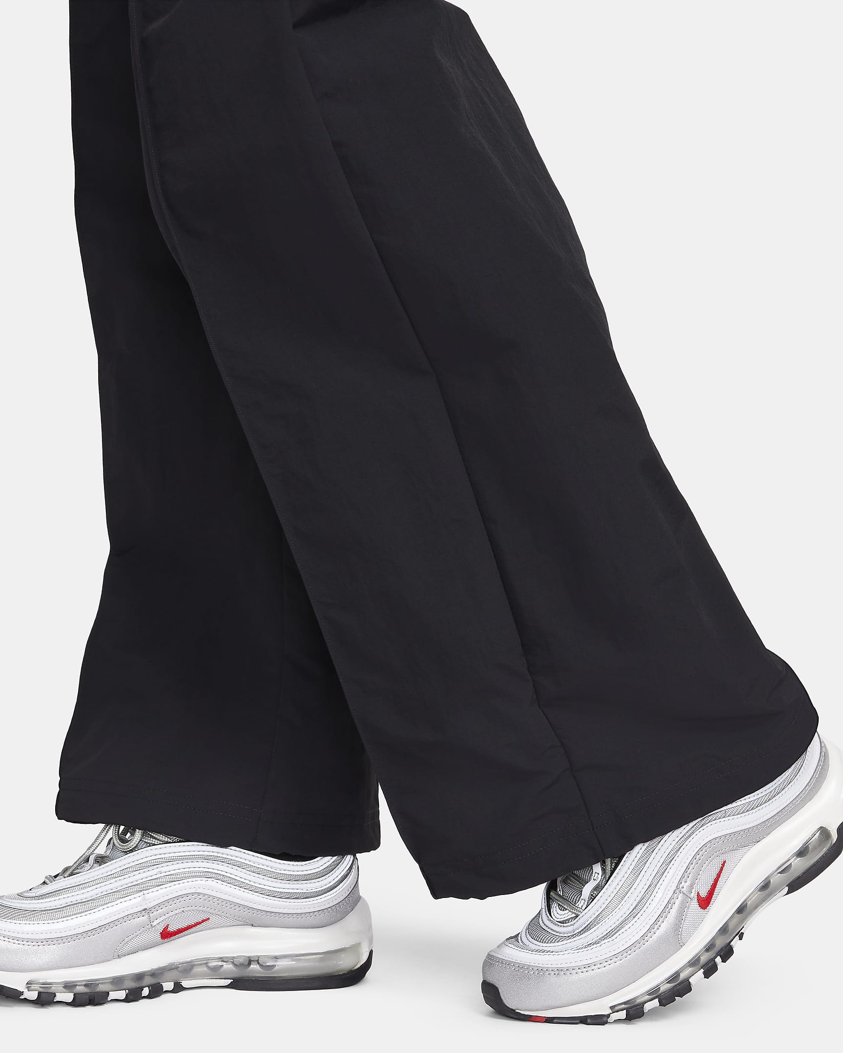 Pantaloni a vita media con bordo aperto Nike Sportswear Everything Wovens – Donna - Nero/Bianco