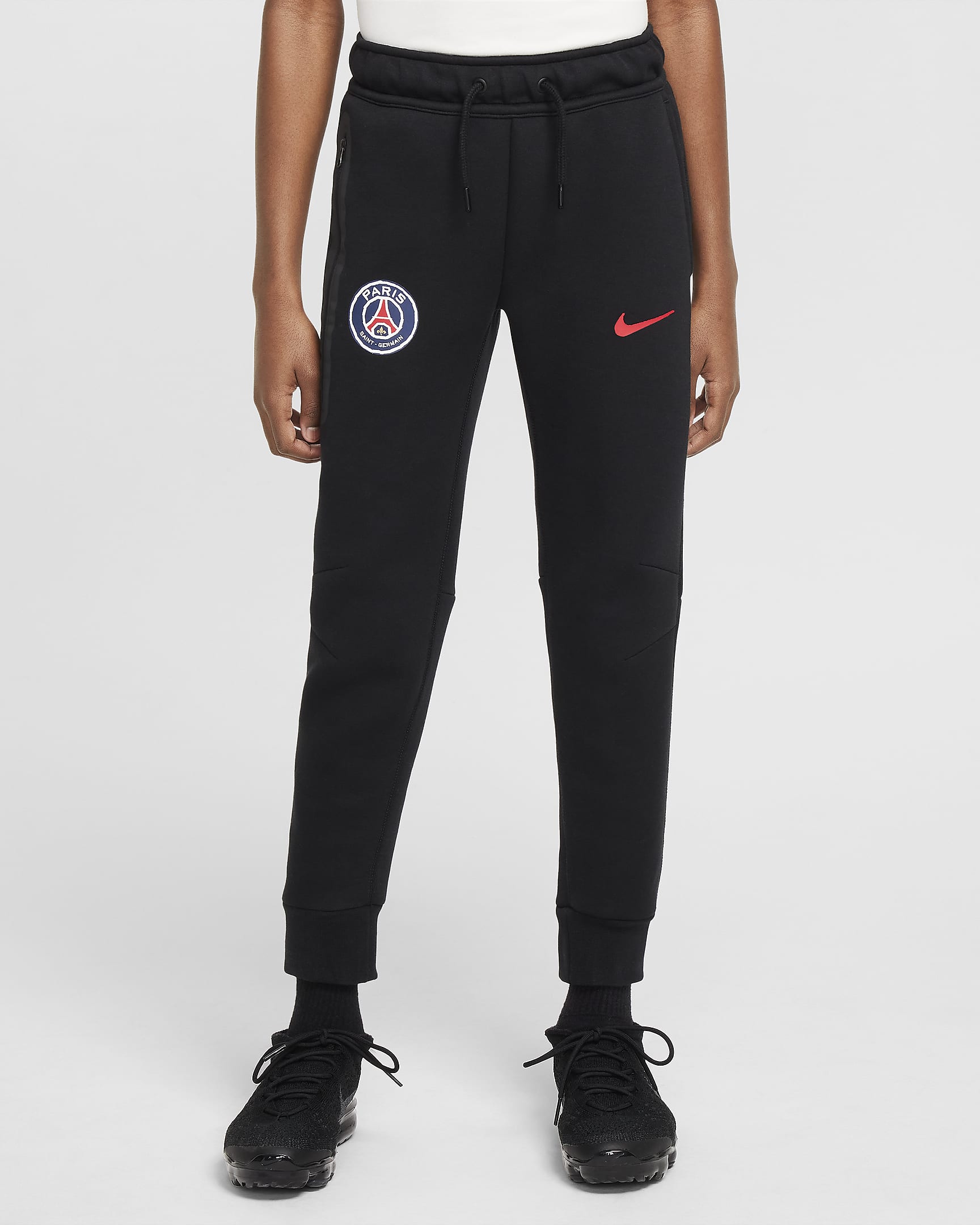 Paris Saint-Germain Tech Fleece Nike Football-bukser til større børn (drenge) - sort/University Red