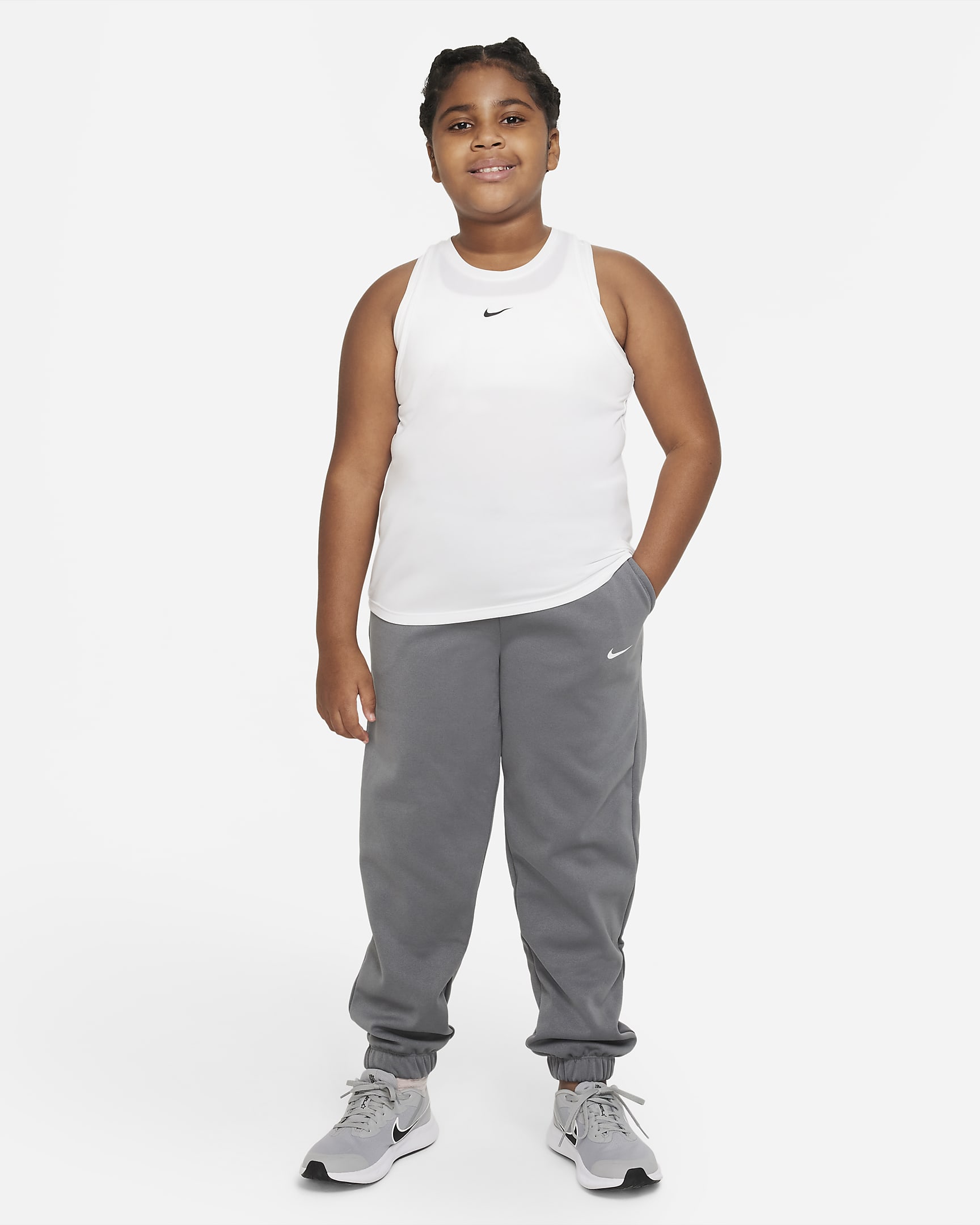 Nike Therma-FIT Big Kids' (Girls') Cuffed Pants (Extended Size). Nike.com
