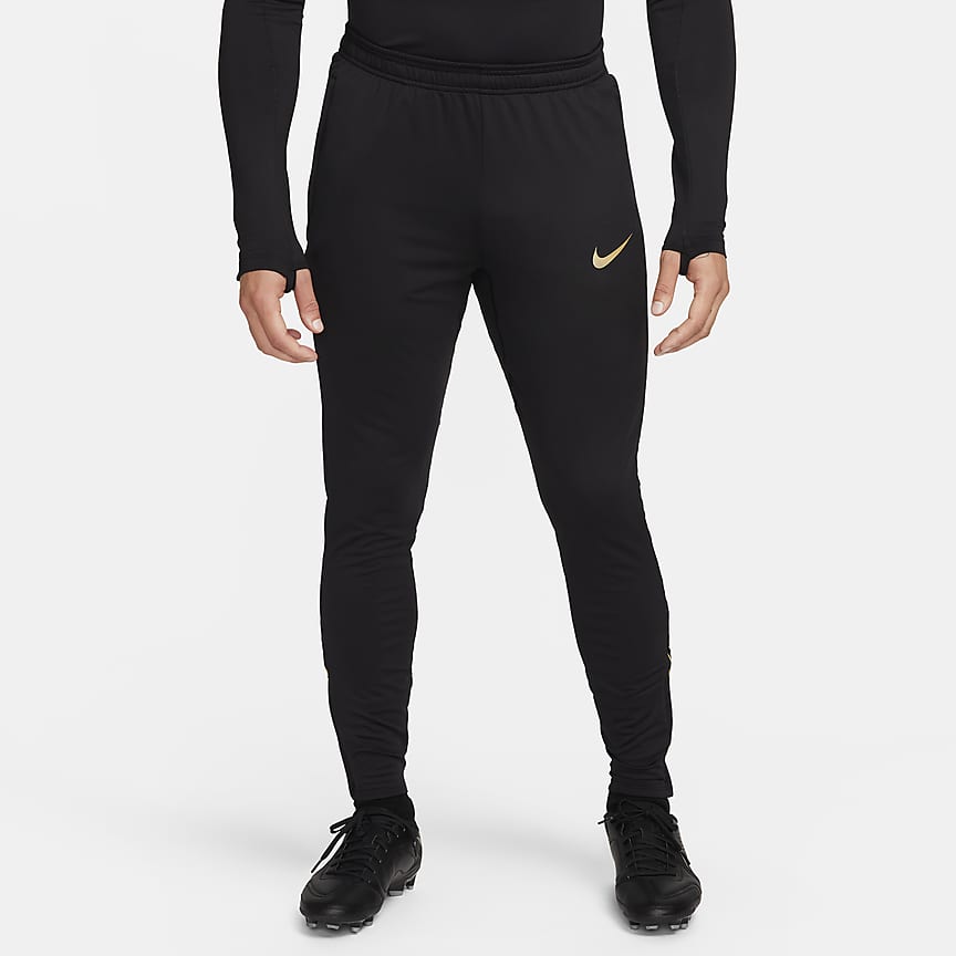 Nike football academy tapered joggers best sale in black