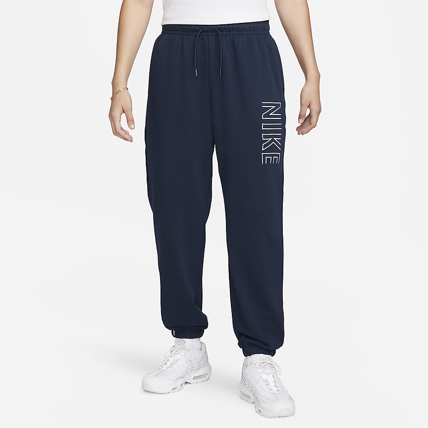 Front Three Quarter view of Women's Nike Sportswear Essential Jogger Pants  in Grey/White
