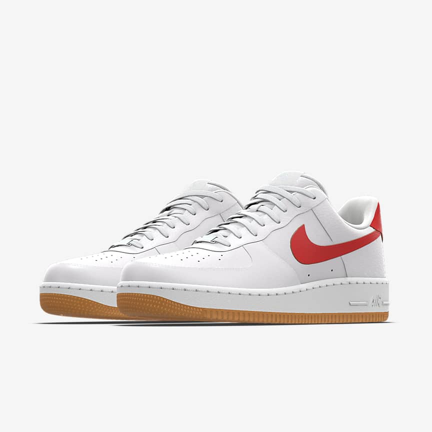 White Nike Air Force 1s with red checkmark