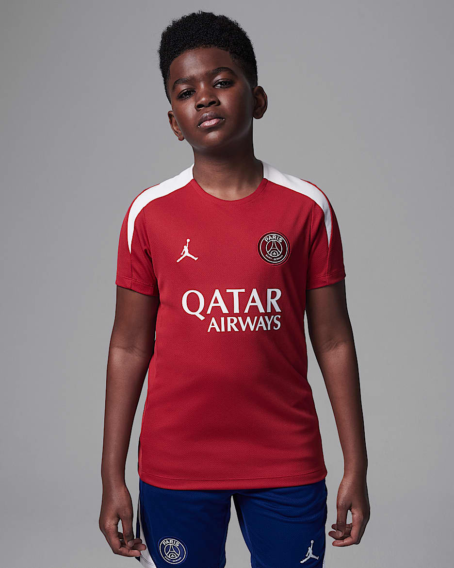 Paris Saint-Germain Strike Fourth Older Kids' Jordan Dri-FIT Football Knit Short-Sleeve Top - Wings Jordan Red/Wings Jordan Red/Phantom/Phantom