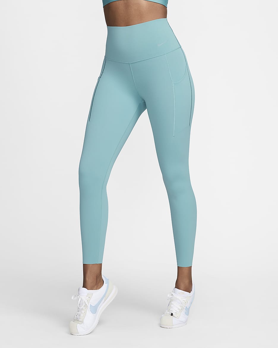 Leggings de 7/8 de tiro alto y sujeción media con bolsillos para mujer Nike Universa - Denim turquesa/Negro