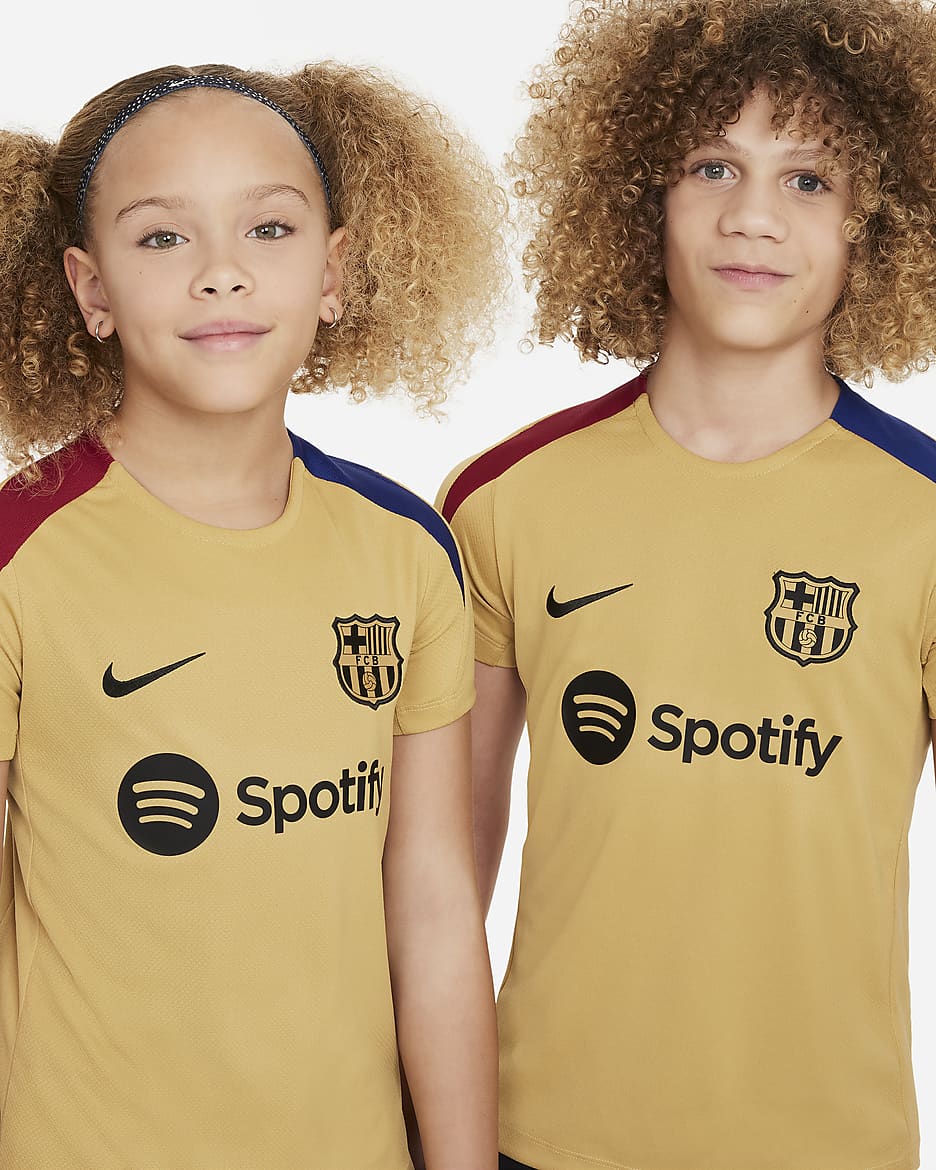 FC Barcelona Strike Nike Dri-FIT kortermet strikket fotballoverdel til store barn - Club Gold/Noble Red/Deep Royal Blue/Svart