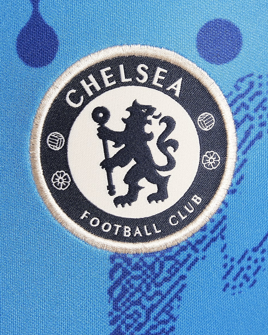 Chelsea FC Academy Pro Camiseta de fútbol de manga corta para antes del partido Nike Dri-FIT - Niño/a - Light Photo Blue/Rush Blue/Guava Ice