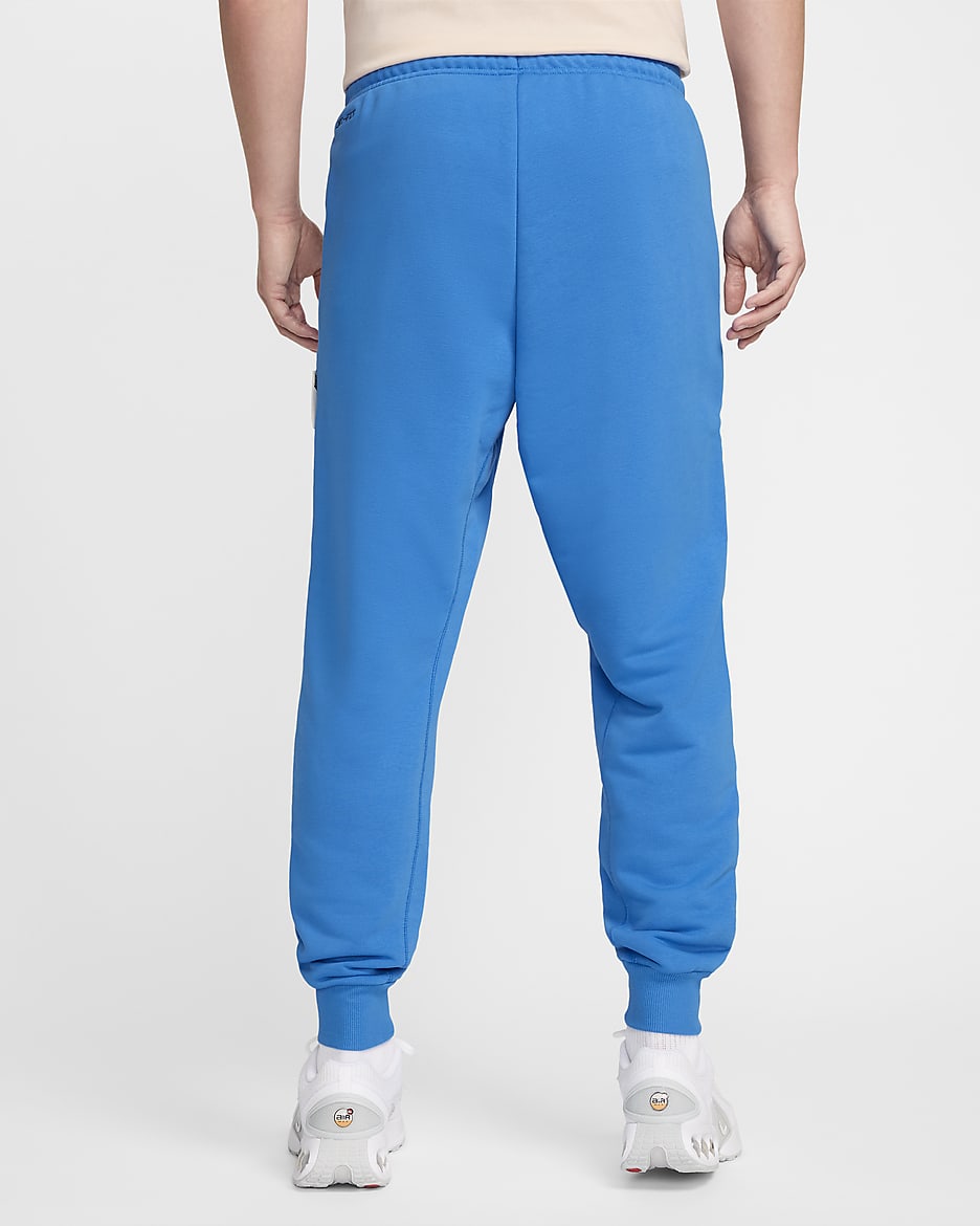 Pantalon de foot fuselé Nike Dri-FIT Chelsea FC Standard Issue pour homme - Light Photo Blue/Guava Ice