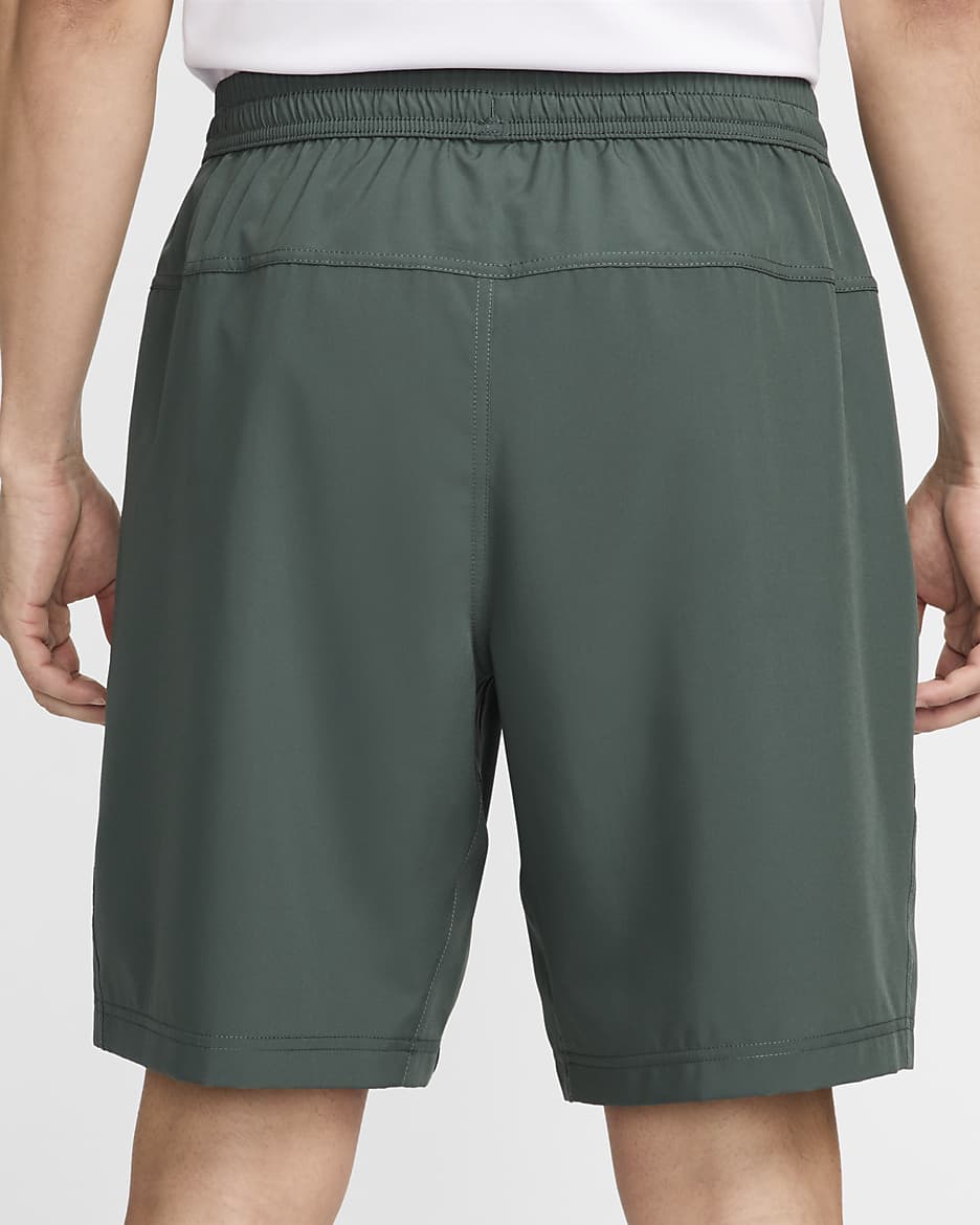 Shorts versátiles Dri-FIT de 23 cm sin forro para hombre Nike Form - Verde vintage/Negro