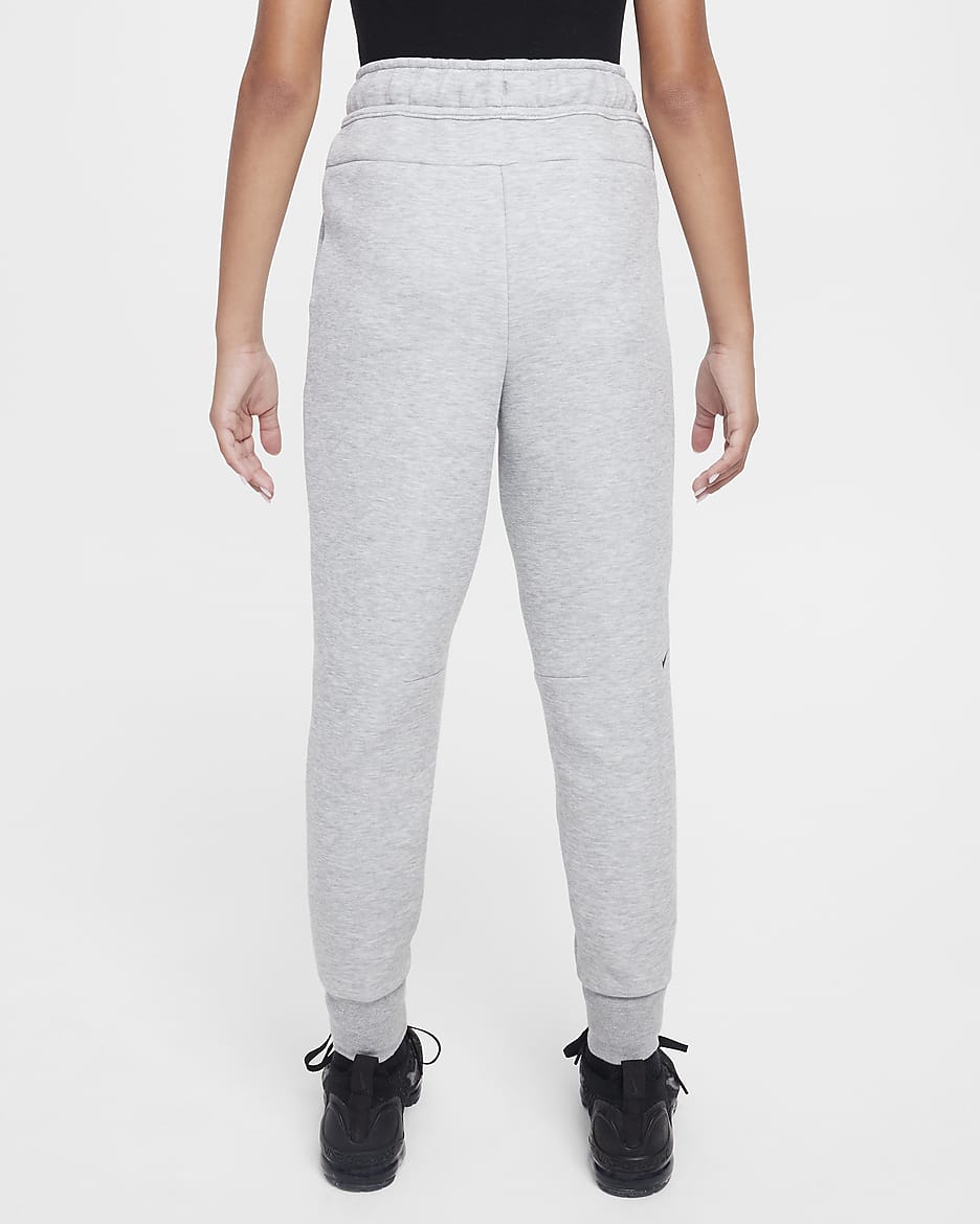 Běžecké kalhoty Nike Sportswear Tech Fleece pro větší děti (dívky) - Dark Grey Heather/Černá/Černá/Černá