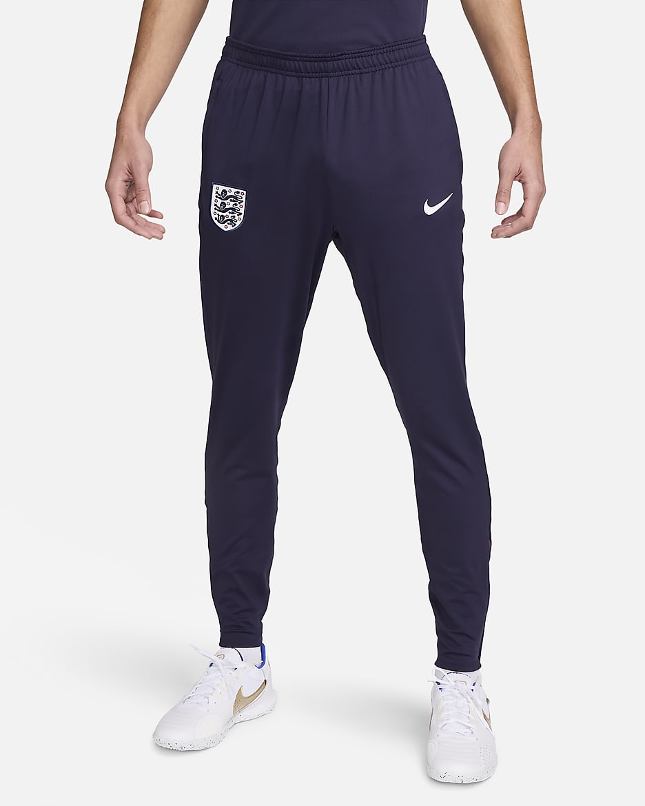 Męskie spodnie piłkarskie z dzianiny Nike Dri-FIT Anglia Strike - Purple Ink/Rosewood/Biel