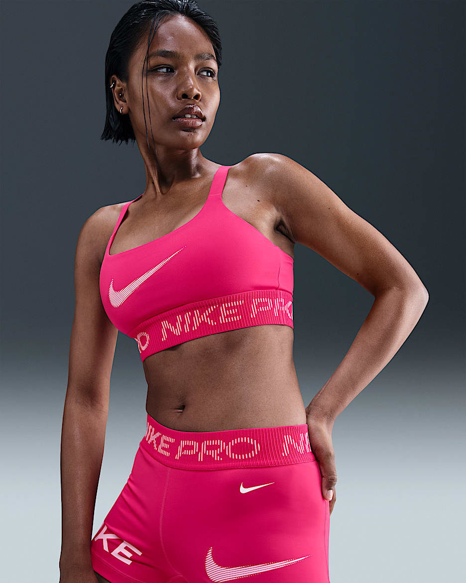 Bra deportivo de baja sujeción sin almohadilla para mujer Nike Pro - Rosa enérgico/Espuma rosa/Blanco