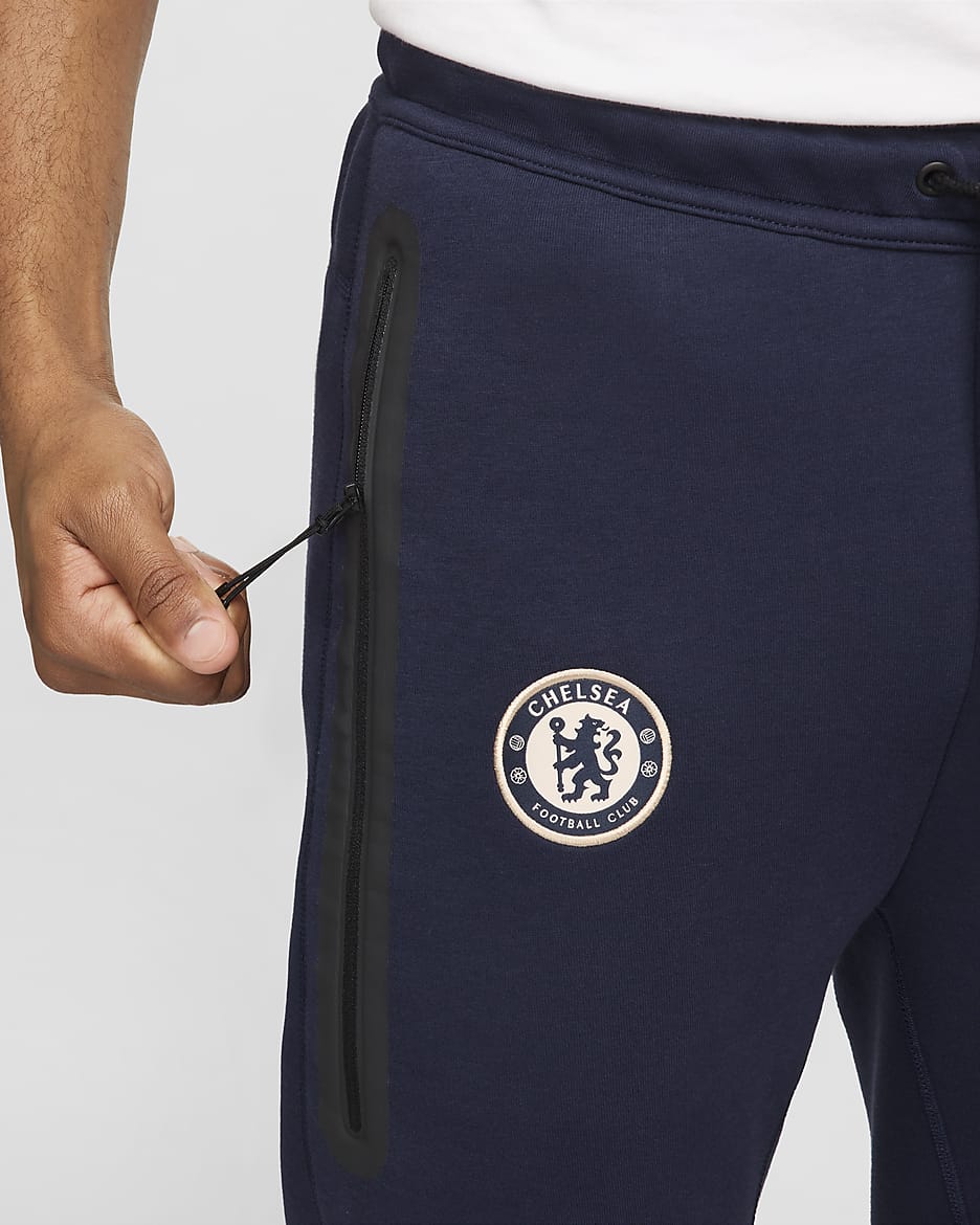 Chelsea F.C. Tech Fleece Men's Nike Football Joggers - Obsidian/Guava Ice