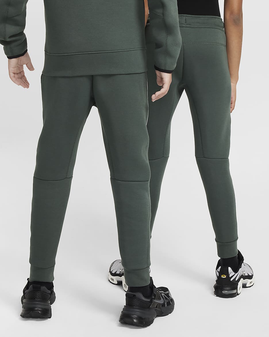 Reflexní běžecké kalhoty Nike Sportswear Tech Fleece pro větší děti - Vintage Green