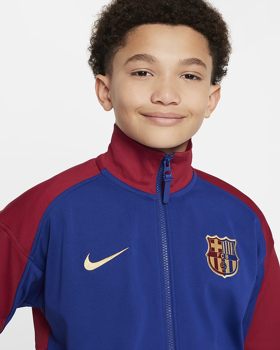 FC Barcelona Academy Pro Thuis Nike Dri-FIT voetbalvolksliedjack voor kids - Deep Royal Blue/Noble Red/Club Gold