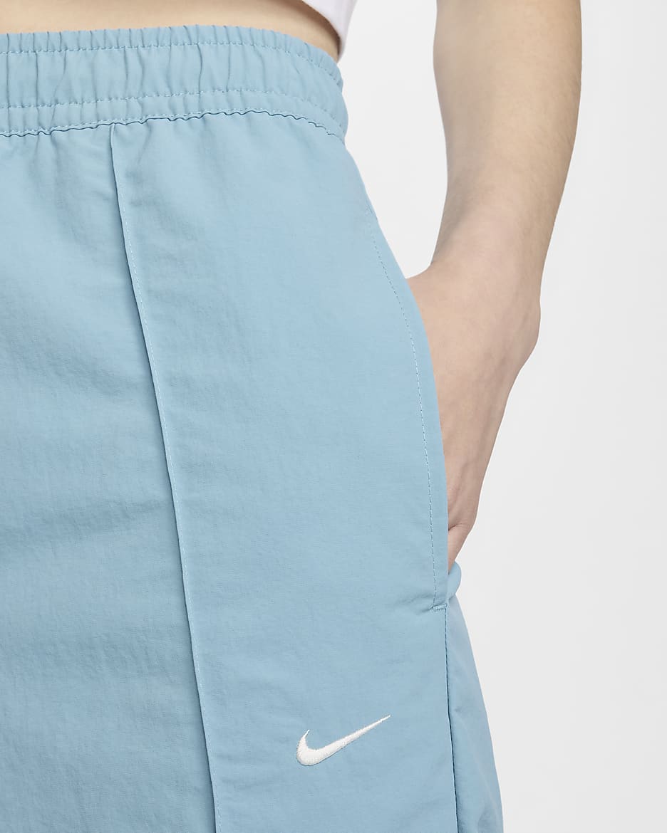 Pants de tiro medio con dobladillo abierto para mujer Nike Sportswear Everything Wovens - Denim turquesa/Vela