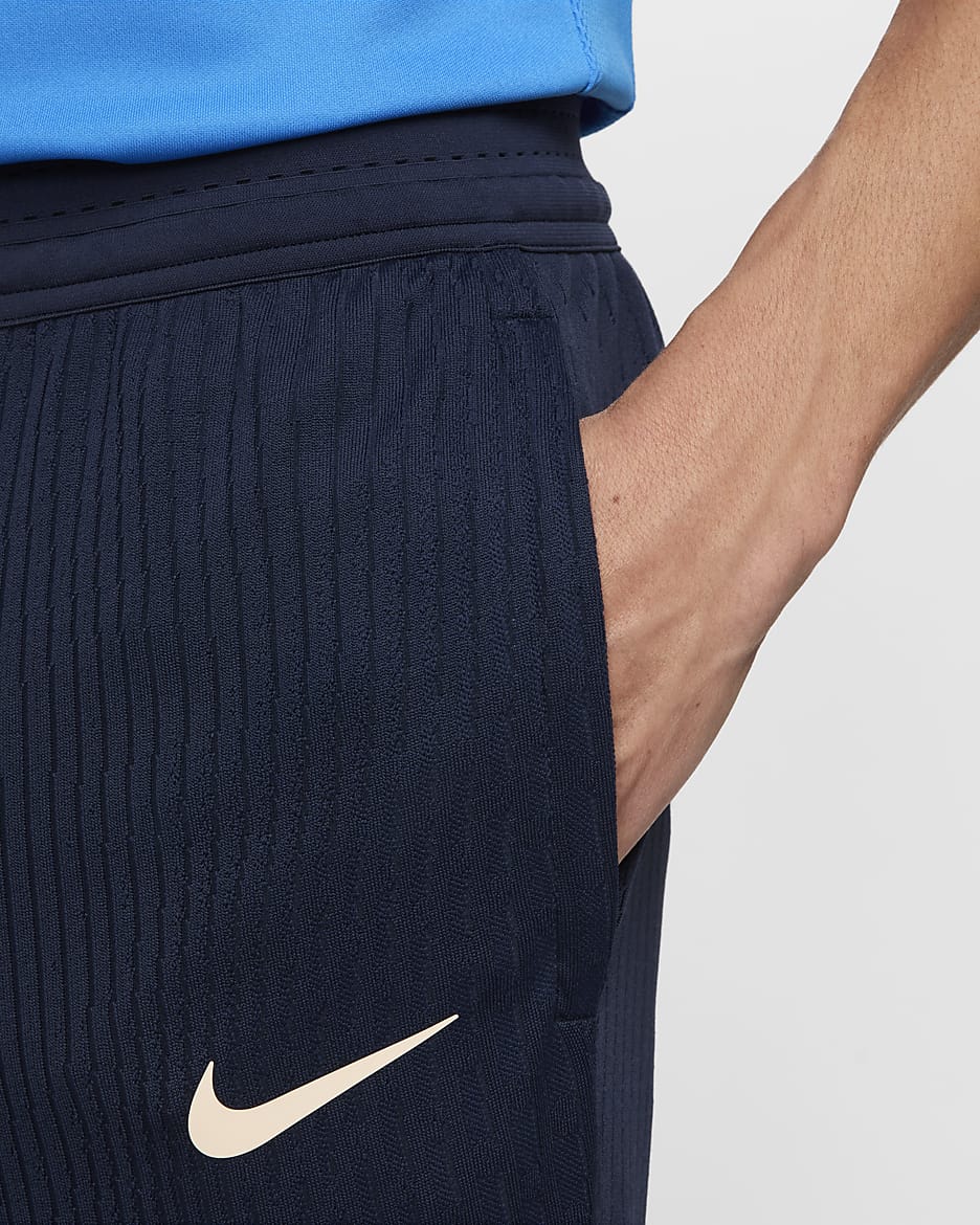 Chelsea FC Strike Elite Pantalón de fútbol de tejido Knit Nike Dri-FIT ADV - Hombre - Obsidian/Light Photo Blue/Guava Ice