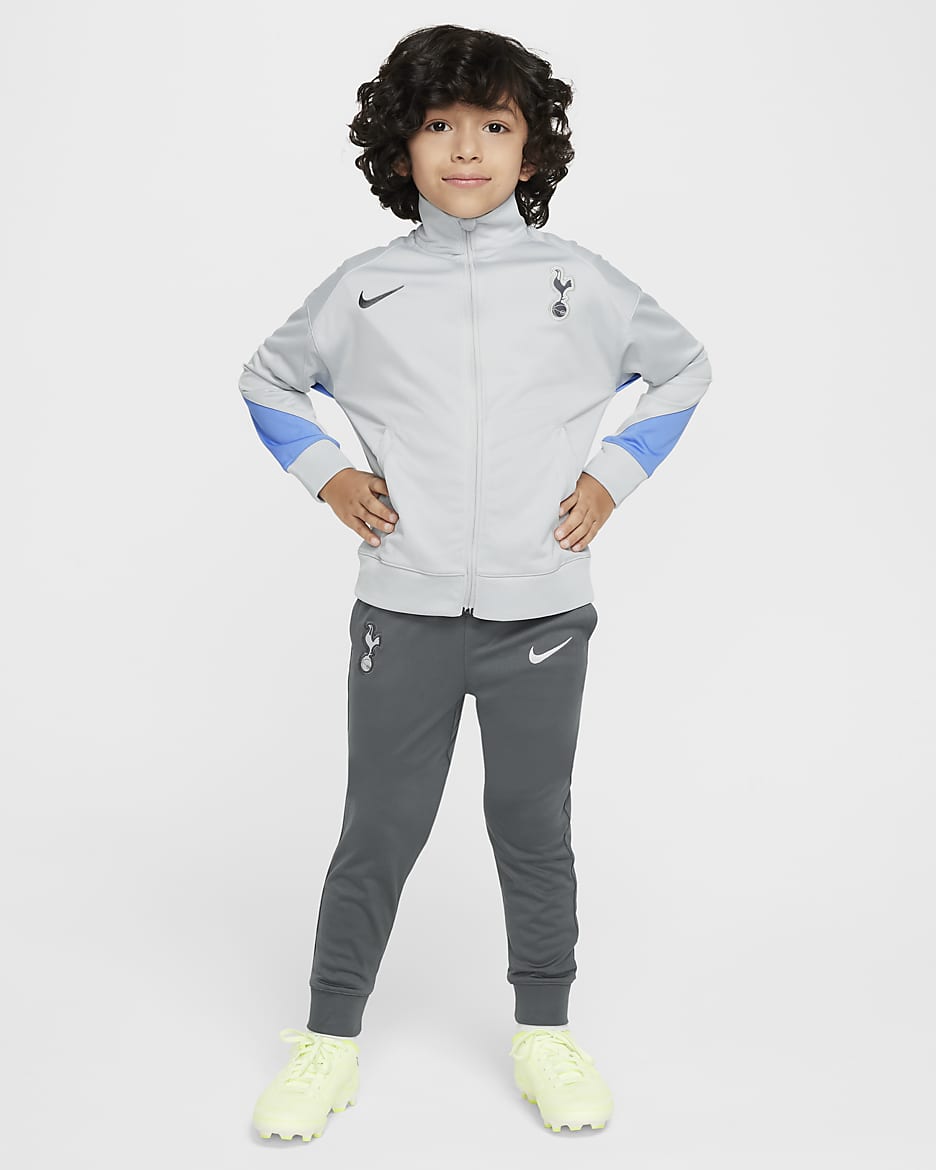 Pleteninová fotbalová sportovní souprava Tottenham Hotspur Strike Nike Dri-FIT pro malé děti - Grey Fog/Polar/Dark Grey/Dark Grey