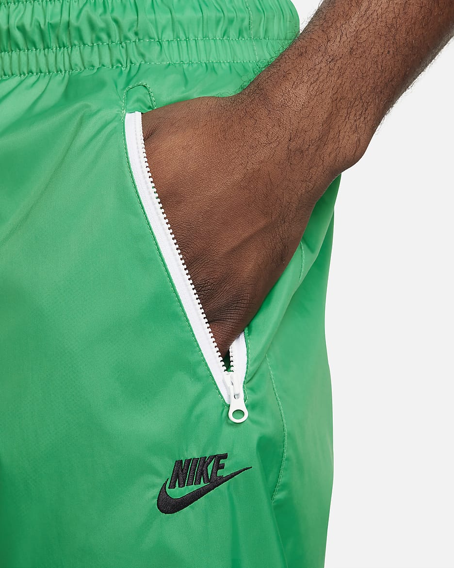 Nike Windrunner Geweven herenbroek met voering - Stadium Green/Zwart