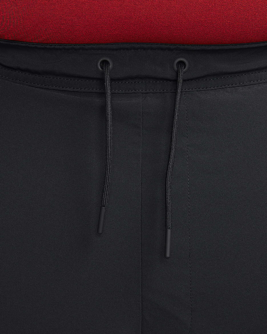 Nike Unlimited Pantalons curts versàtils sense folre de 23 cm Dri-FIT - Home - Negre/Negre/Negre