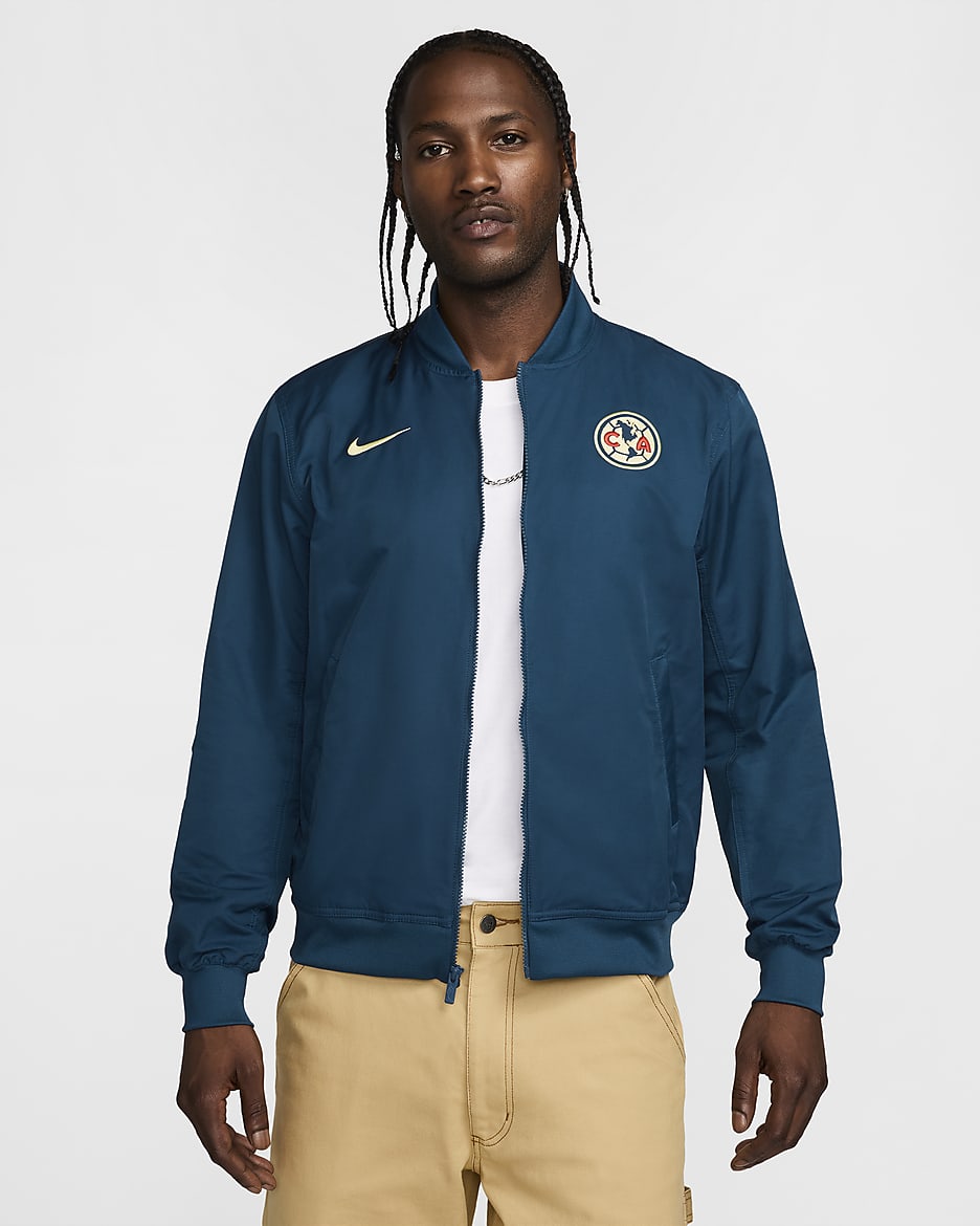 Chamarra bomber de fútbol Nike de tejido Woven y sin forro para hombre Club América Sport Essentials - Azul valeriana/Chifón limón