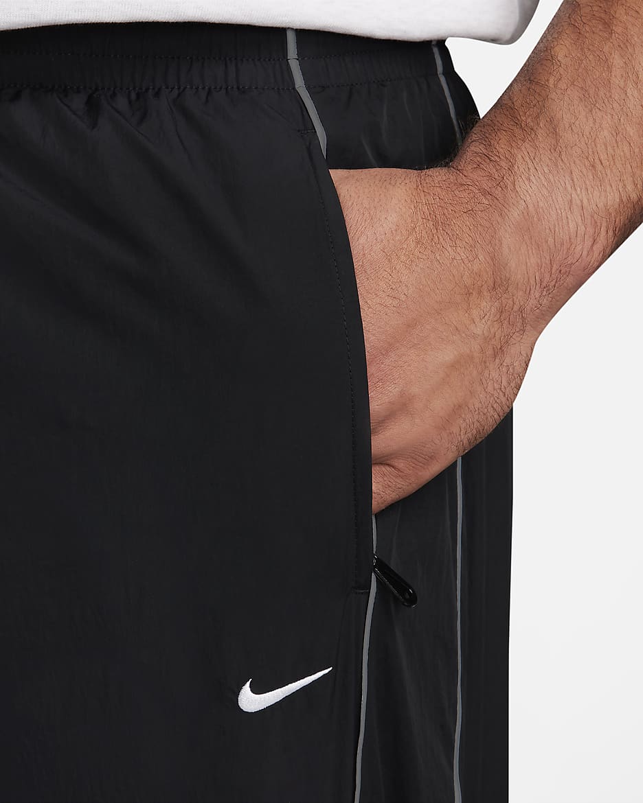 Nike Solo Swoosh trainingsbroek voor heren - Zwart/Wit