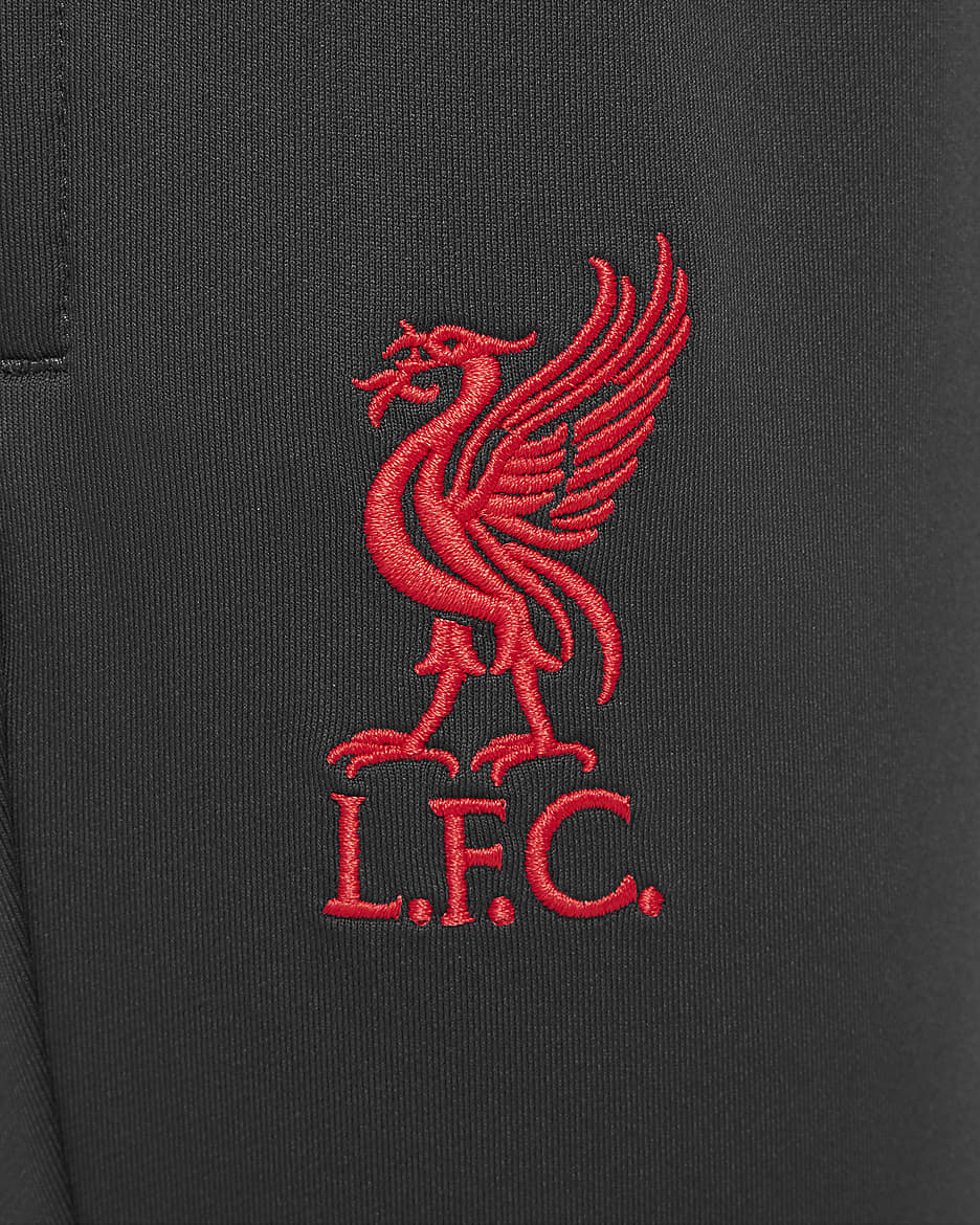 Spodnie piłkarskie dla dużych dzieci Nike Dri-FIT Liverpool F.C. Strike (wersja trzecia) - Dark Smoke Grey/Chrome Yellow/Global Red