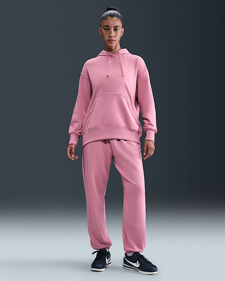 Pants de entrenamiento de French Terry oversized de tiro alto para mujer Nike Sportswear Phoenix Fleece - Rosa elemental/Rosa elemental