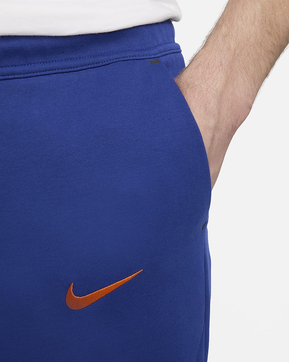 Niederlande Tech Fleece Nike Fußball-Jogger für Herren - Deep Royal Blue/Safety Orange