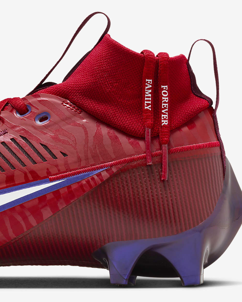 Burgundy nike football cleats top