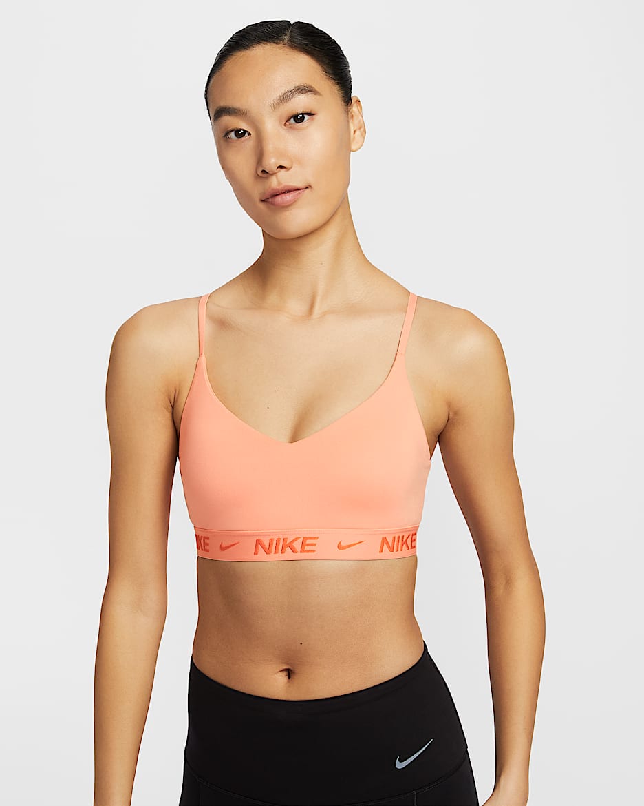 สปอร์ตบราผู้หญิงแบบปรับได้เสริมฟองน้ำ Nike Indy Light Support - Apricot Agate/Apricot Agate
