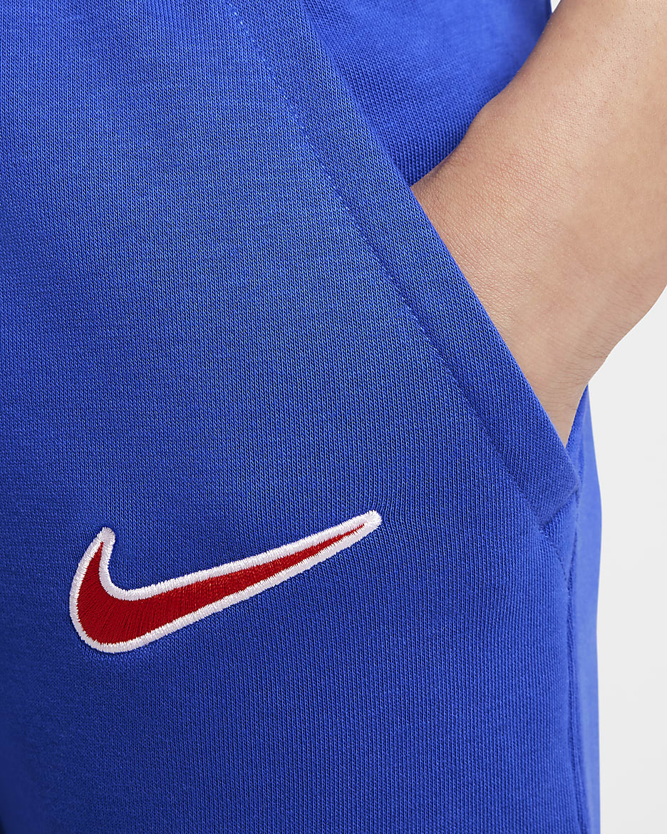 Atlético Madrid Club Thuis Nike voetbaljoggingbroek van sweatstof voor jongens - Game Royal/Light Crimson