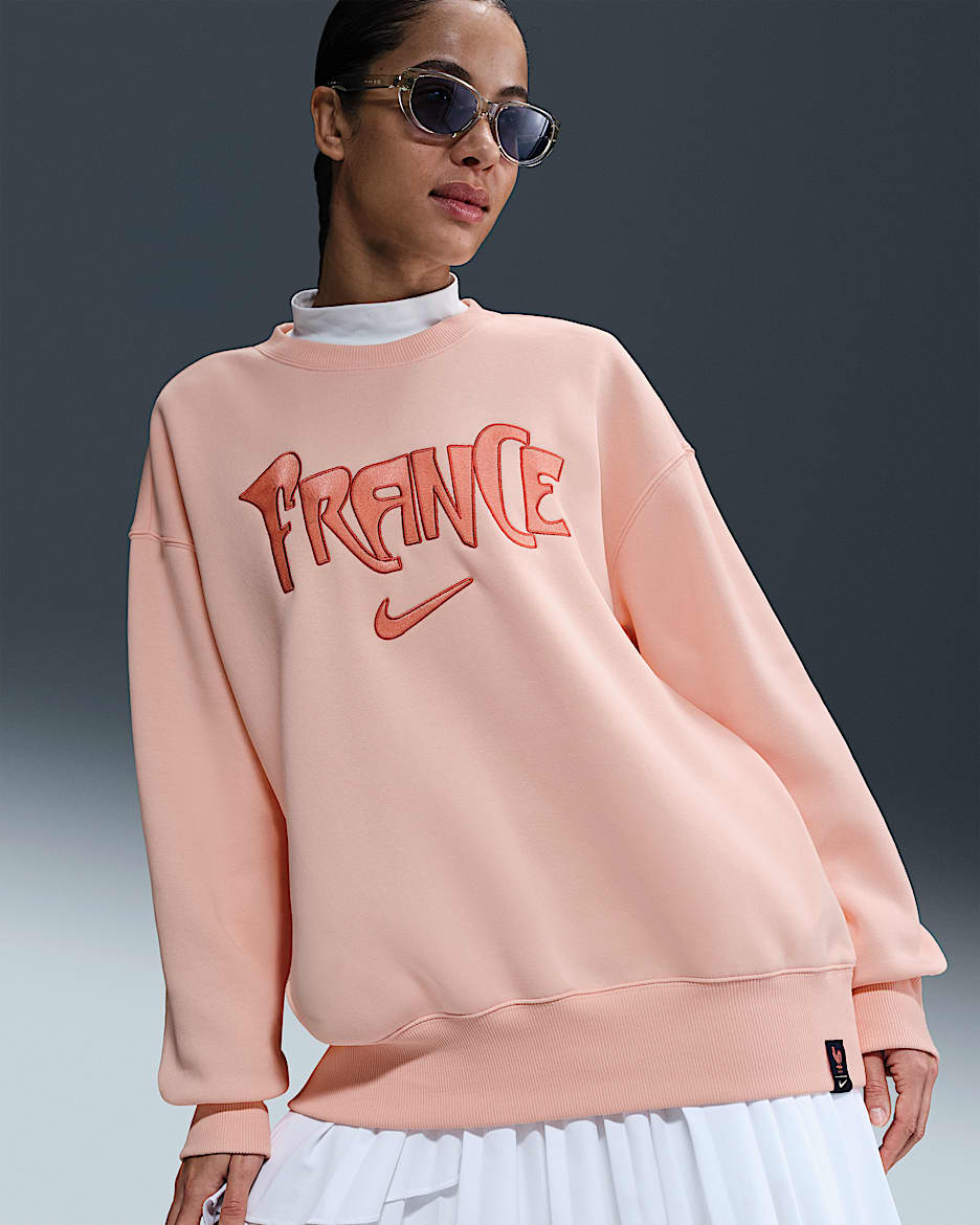 France Phoenix Fleece Women's Nike Football Oversized Crew-Neck Sweatshirt - Washed Coral/Washed Coral/Bleached Coral
