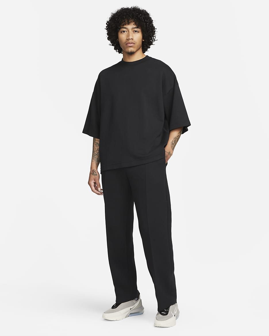 Nike Sportswear Tech Fleece Reimagined joggingbroek met open zoom en ruimvallende pasvorm voor heren - Zwart/Zwart