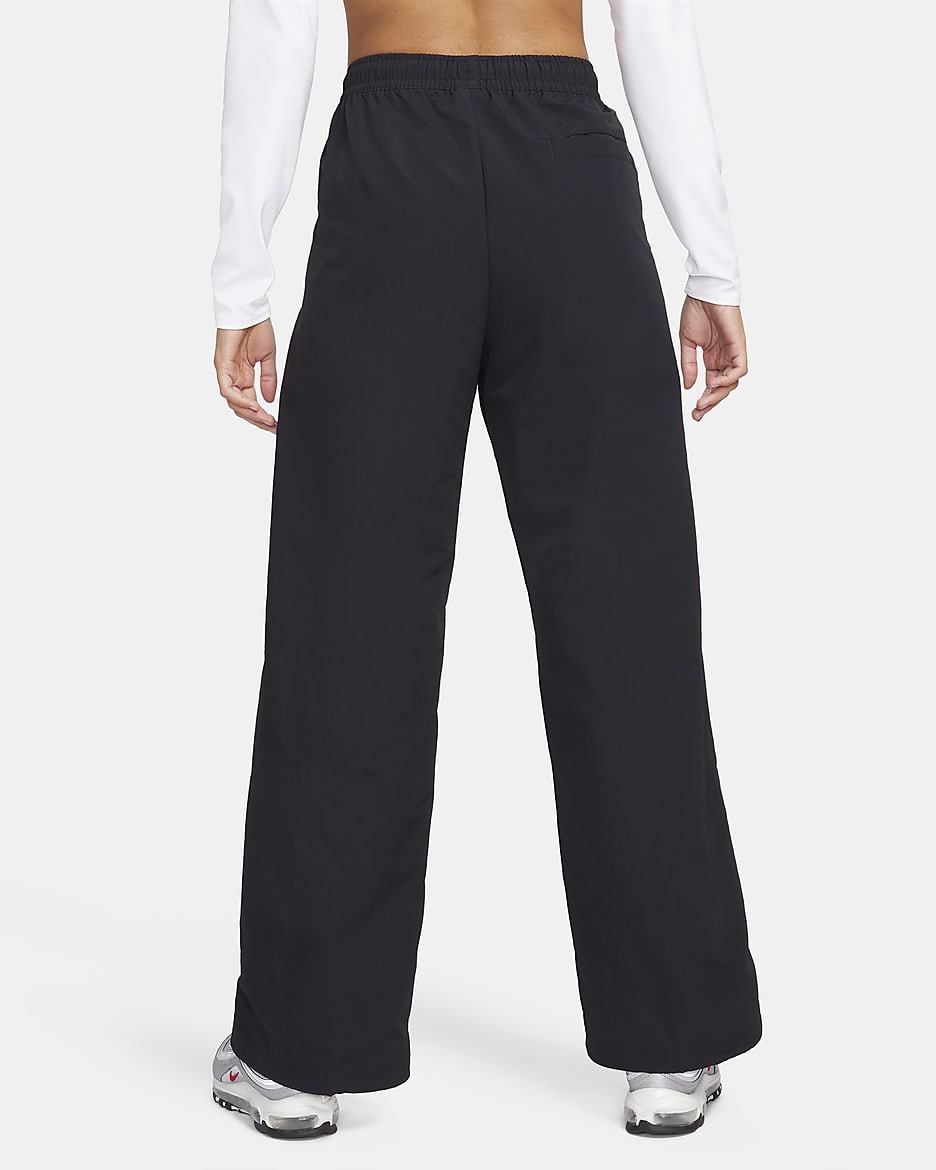 Pantalon taille mi-haute à ourlet ouvert Nike Sportswear Everything Wovens pour femme - Noir/Blanc