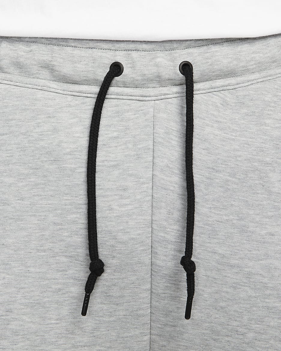 Nike Sportswear Tech Fleece Herren-Trainingshose mit offenem Saum - Dark Grey Heather/Schwarz