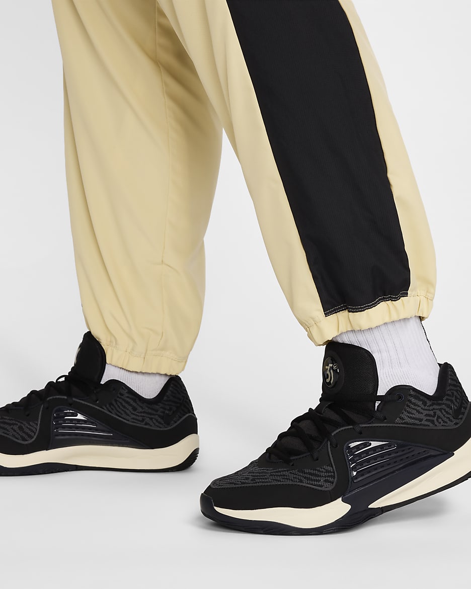 Pantaloni in tessuto da basket Nike Icon – Uomo - Team Gold/Nero/Bianco/Nero