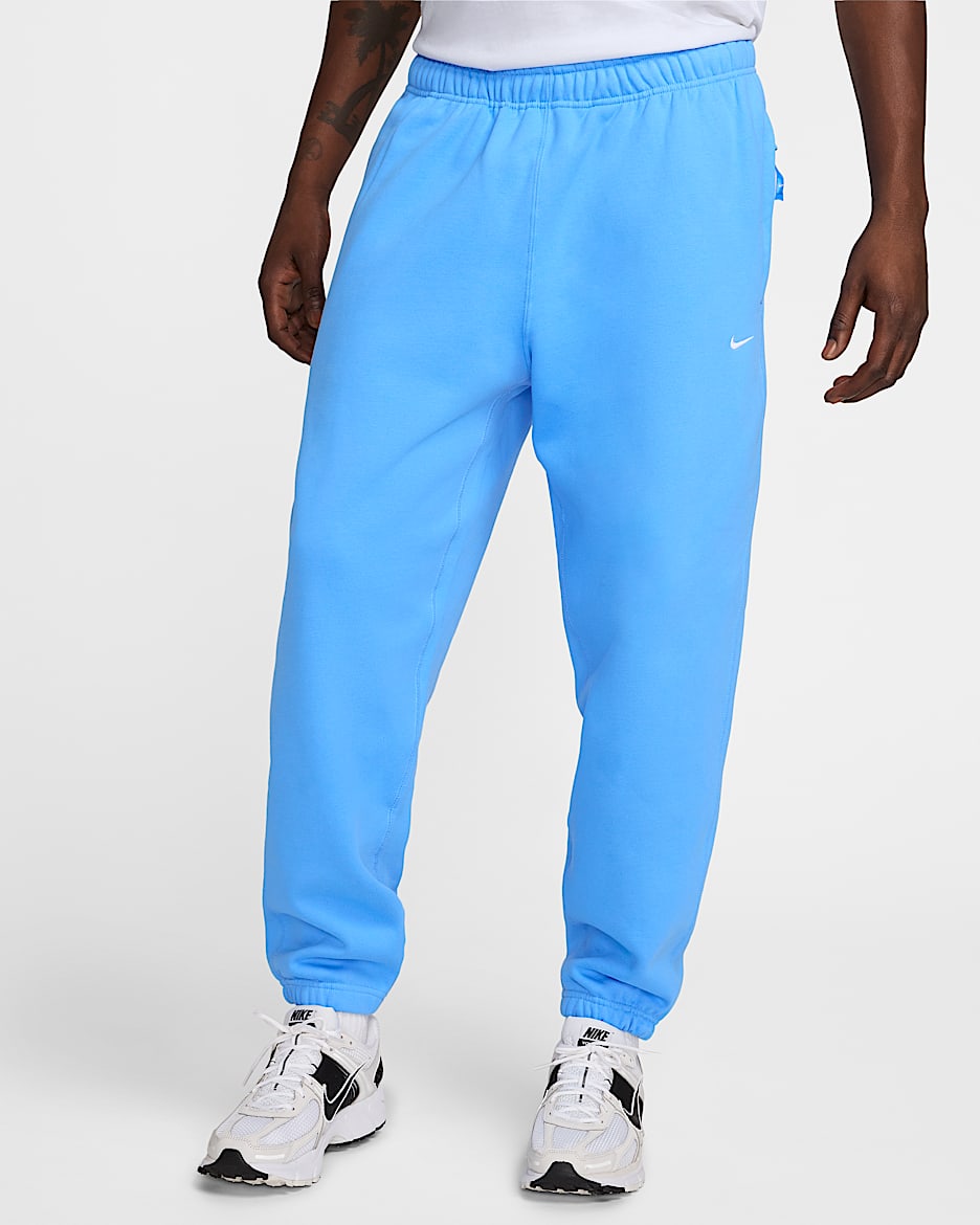 Nike Solo Swoosh Fleecebroek voor heren - University Blue/Wit