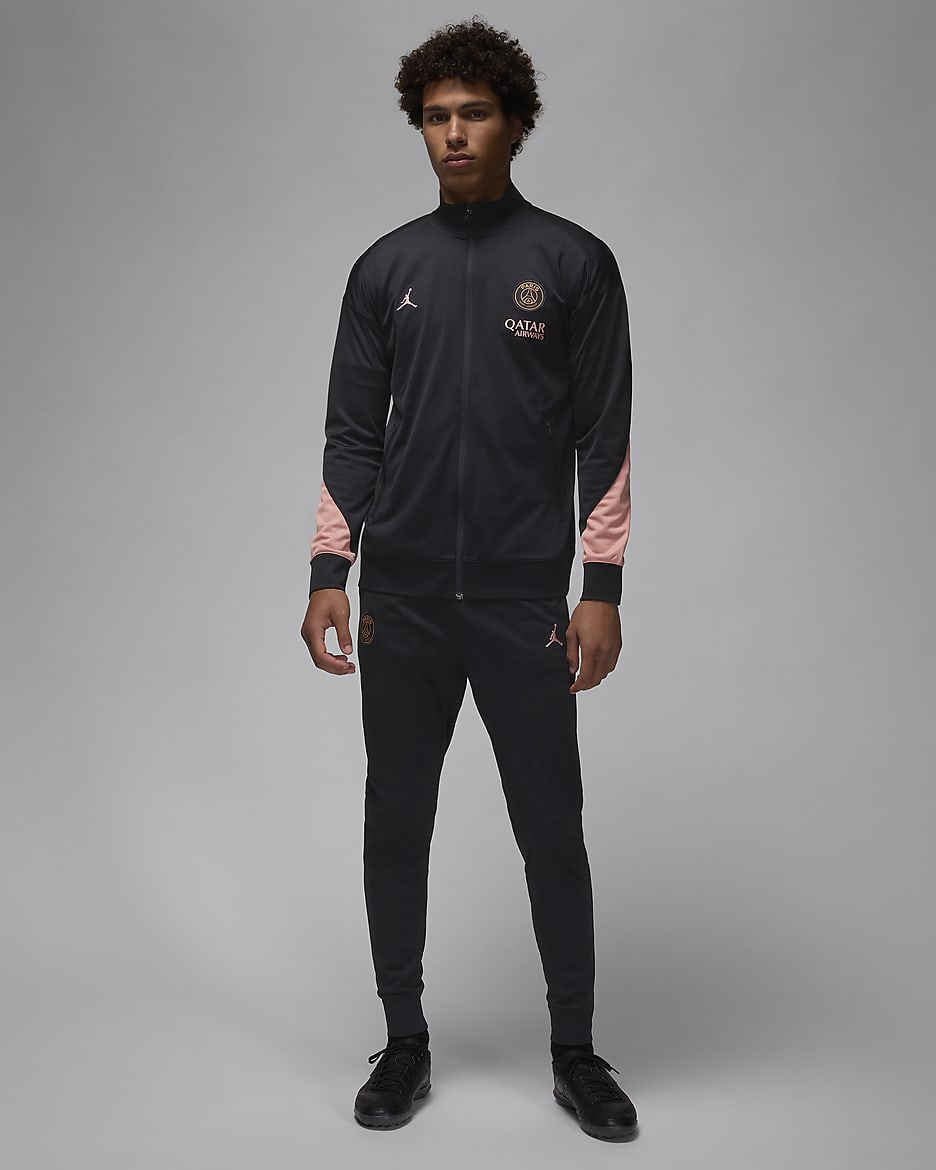 Męski dzianinowy dres piłkarski Jordan Dri-FIT Paris Saint-Germain Strike (wersja trzecia) - Czerń/Rust Pink/Rust Pink