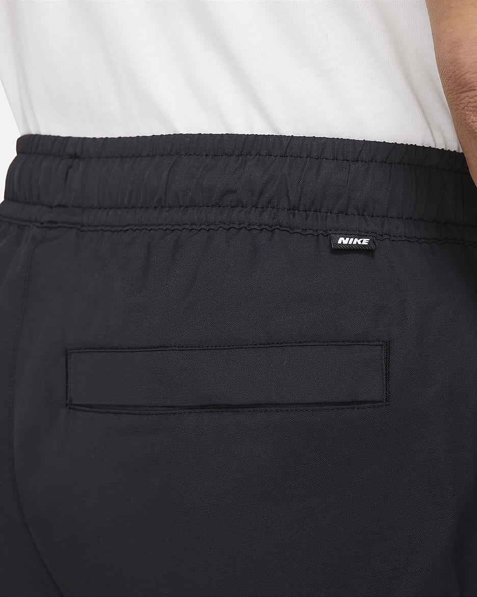 Nike Sportswear Men's Unlined Cuff Trousers. Nike IN