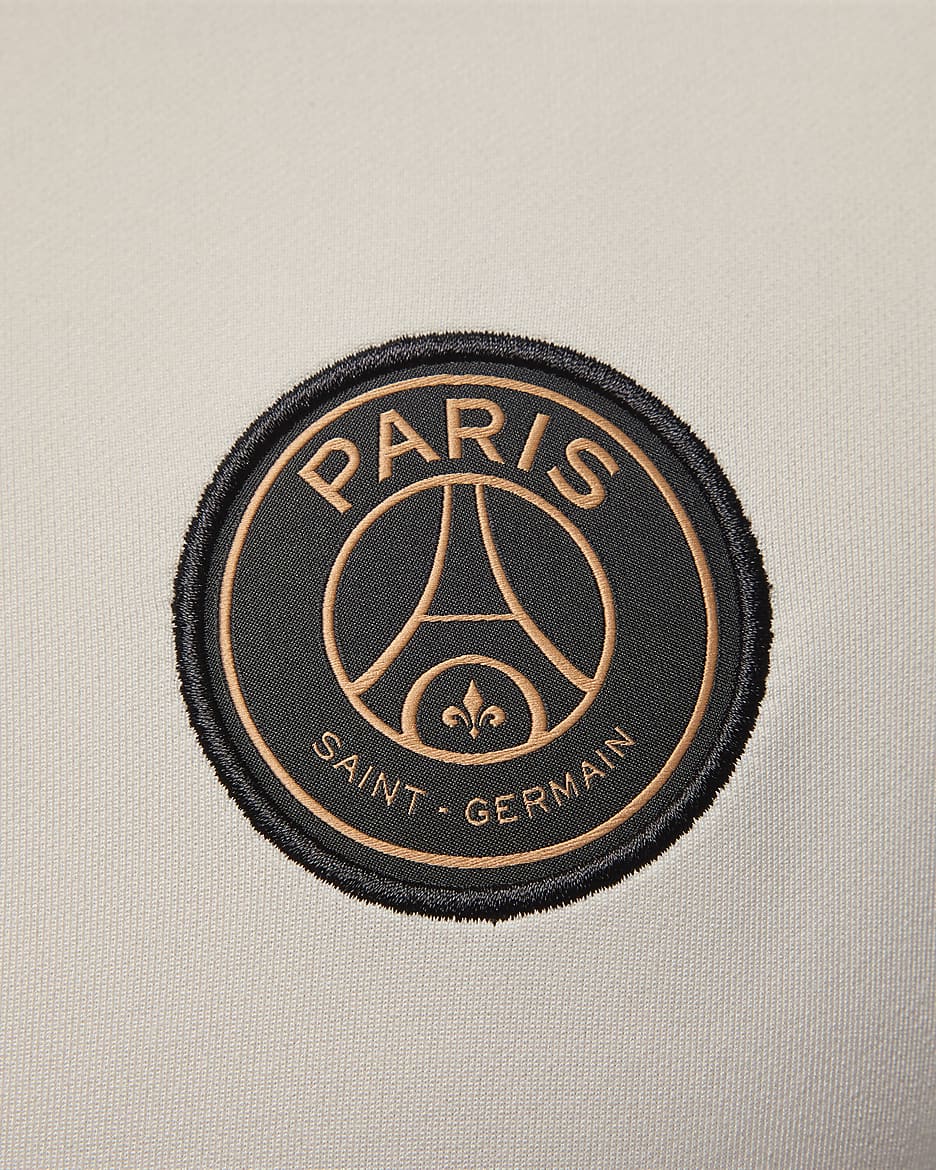 Męska treningowa koszulka piłkarska Jordan Dri-FIT Paris Saint-Germain Strike (wersja trzecia) - Pale Ivory/Rust Pink/Czerń