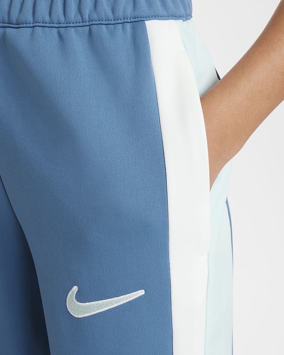 Fotbalové tepláky Nike Academy Dri-FIT pro větší děti - Aegean Storm/Glacier Blue/Bílá/Glacier Blue