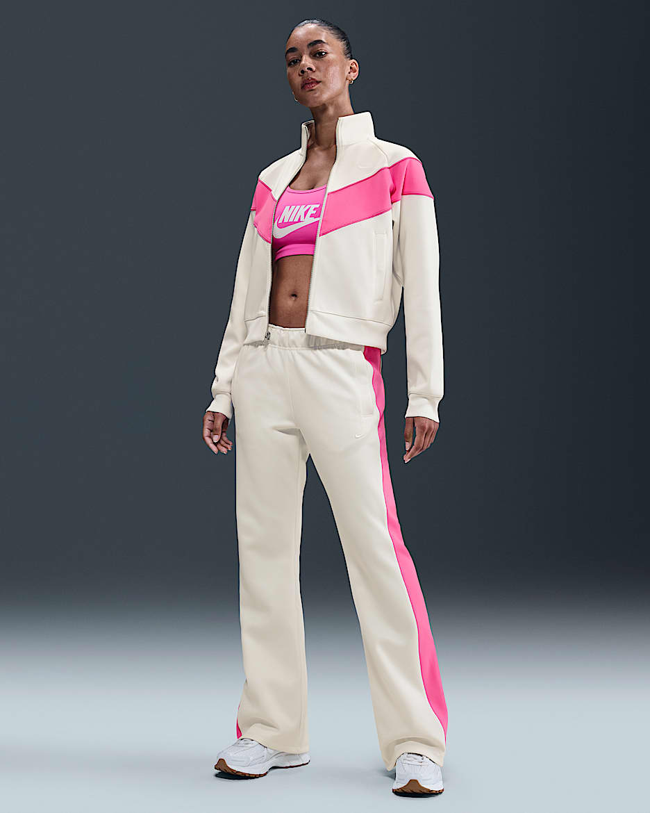 Slimmade byxor Nike Sportswear Windrunner i stickat material med medelhög midja för kvinnor - Sail/Playful Pink/Sail